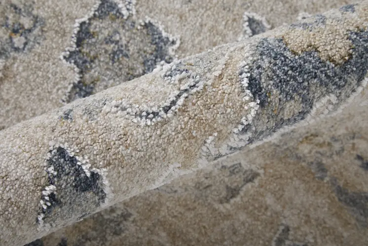7' X 10' Ivory Taupe and Blue Floral Power Loom Worn Faded Area Rug With Fringe
