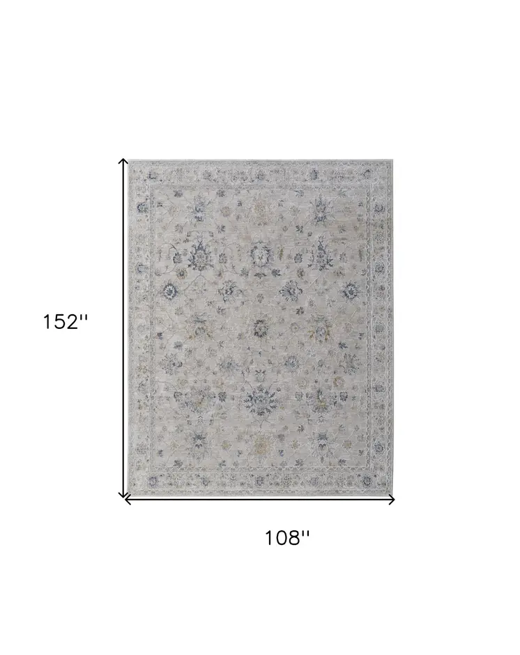 9' X 13' Ivory Taupe and Blue Floral Power Loom Worn Faded Area Rug With Fringe