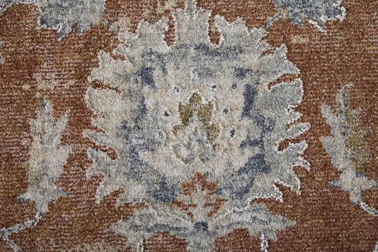 7' X 10' Red Blue and Ivory Floral Power Loom Worn Faded Area Rug With Fringe
