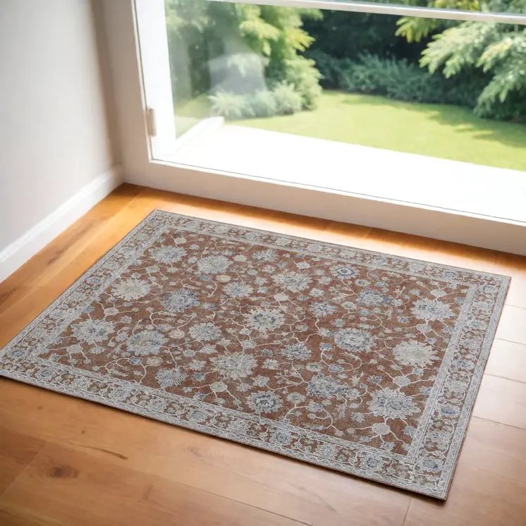 2' X 3' Red Blue and Ivory Floral Power Loom Worn Faded Area Rug With Fringe