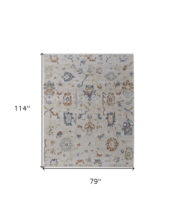 7' X 10' Ivory Blue and Gold Floral Power Loom Worn Faded Area Rug With Fringe