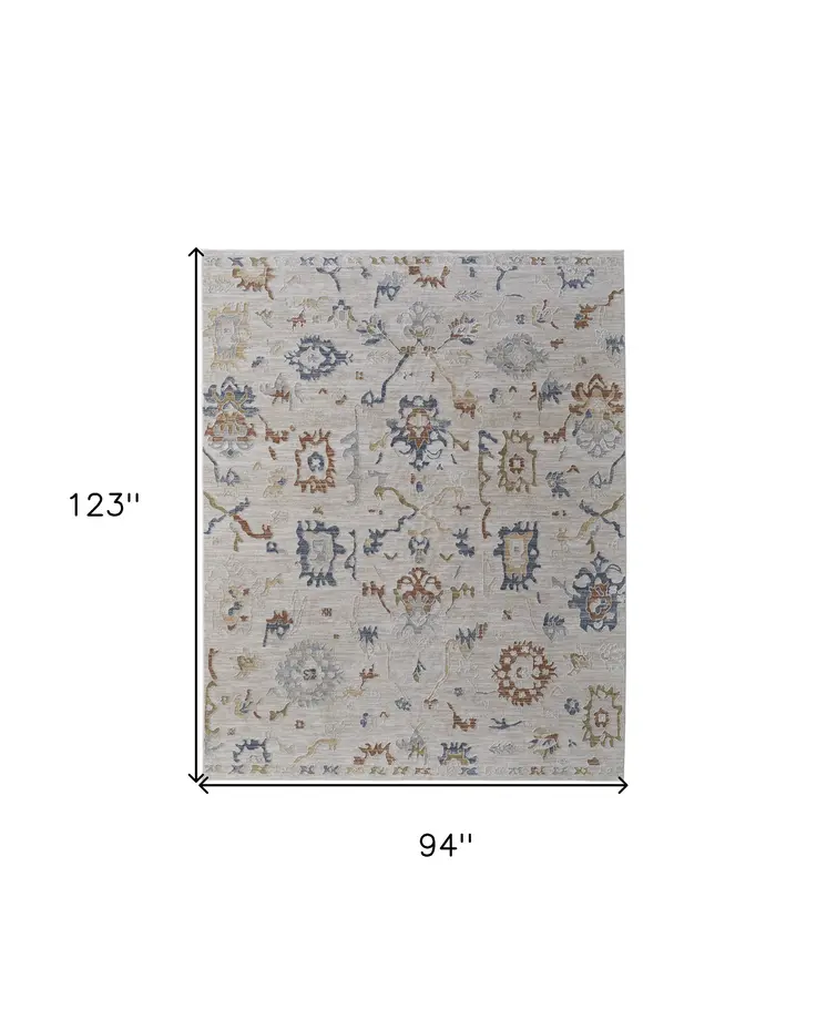 8' X 10' Ivory Blue and Gold Floral Power Loom Worn Faded Area Rug With Fringe