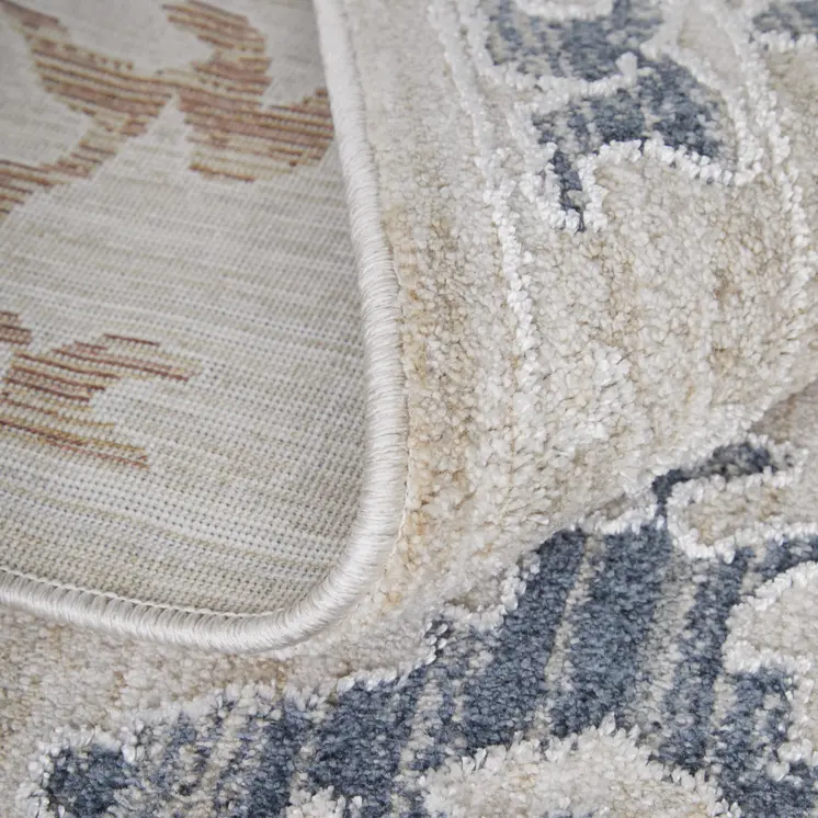 2' X 3' Ivory Blue and Gold Floral Power Loom Worn Faded Area Rug With Fringe