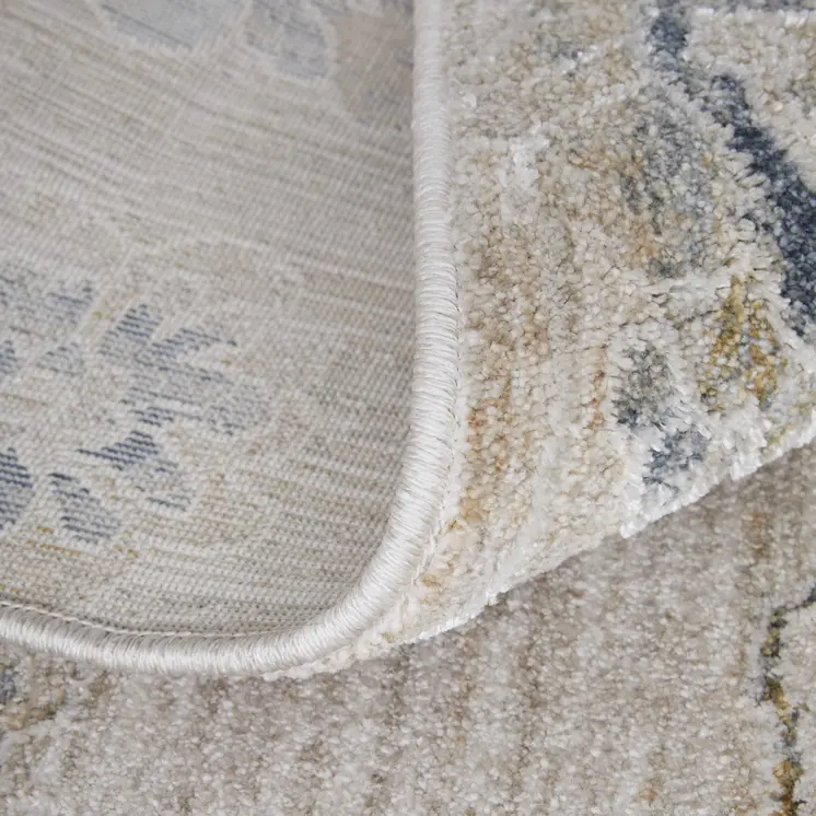 8' X 10' Ivory Taupe and Blue Floral Power Loom Worn Faded Area Rug With Fringe