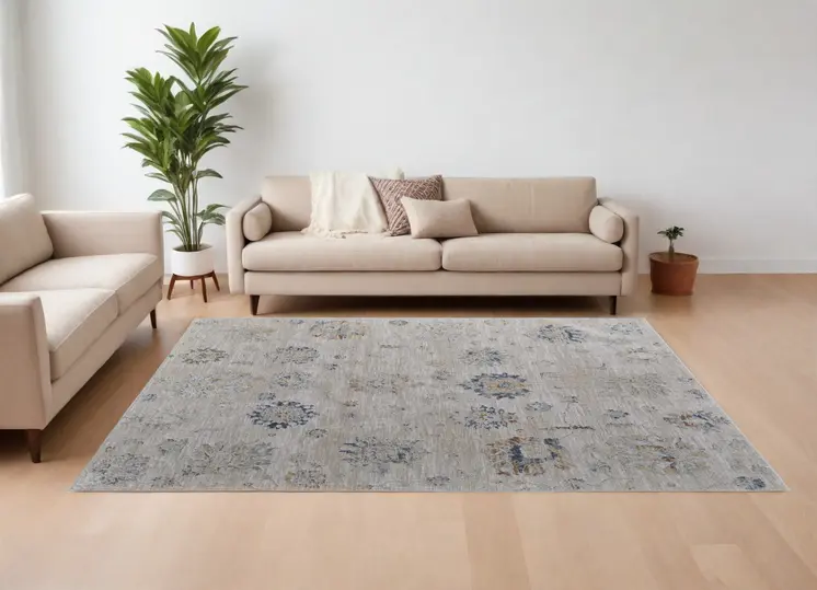 8' X 10' Ivory Taupe and Blue Floral Power Loom Worn Faded Area Rug With Fringe