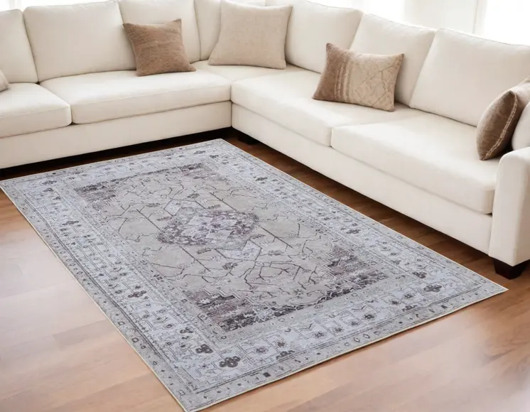 5' X 8' Gray Tan and Ivory Oriental Power Loom Worn Faded Washable Area Rug