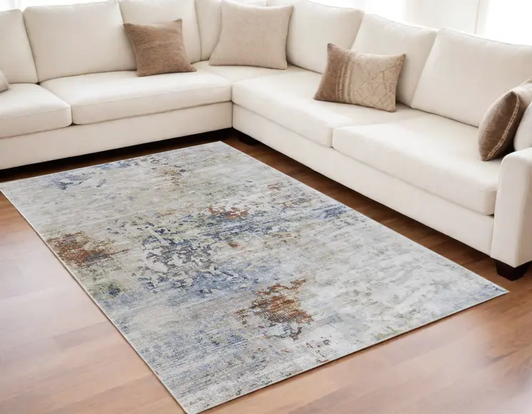 5' X 8' Red Blue and Ivory Abstract Power Loom Area Rug