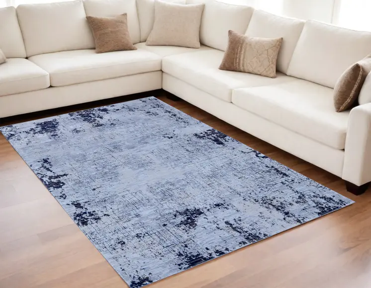 5' X 8' Light Blue and Black Abstract Power Loom Area Rug