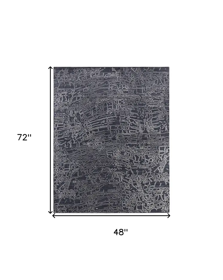 4' X 6' Black Gray and Ivory Abstract Hand Woven Area Rug