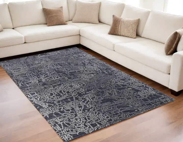 5' X 8' Black Gray and Ivory Abstract Hand Woven Area Rug