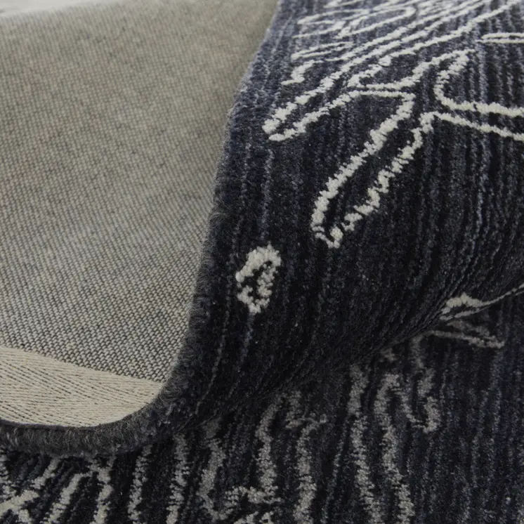 5' X 8' Black Gray and Ivory Abstract Hand Woven Area Rug