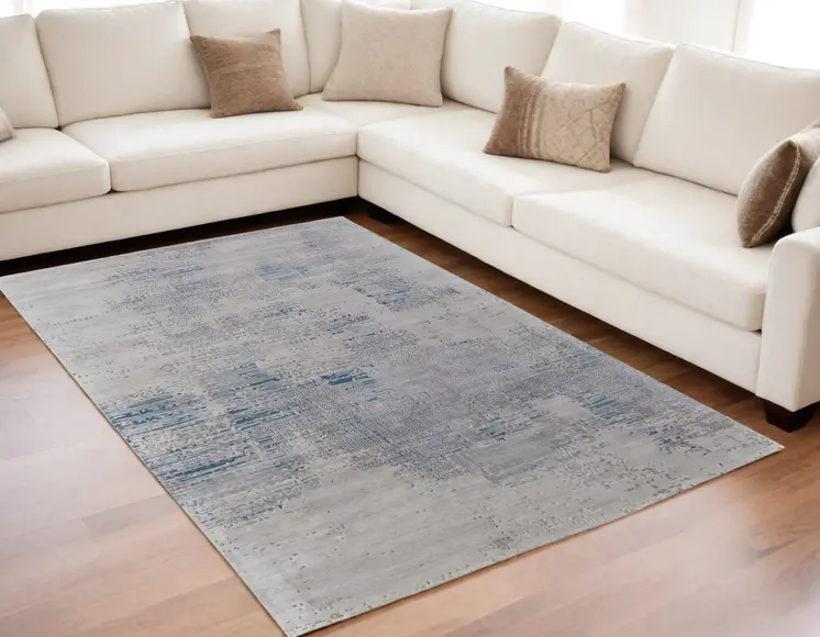 5' X 8' Gray Taupe and Blue Abstract Hand Tufted Area Rug