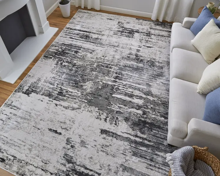 2' X 3' Ivory and Gray Abstract Power Loom Worn Faded Area Rug