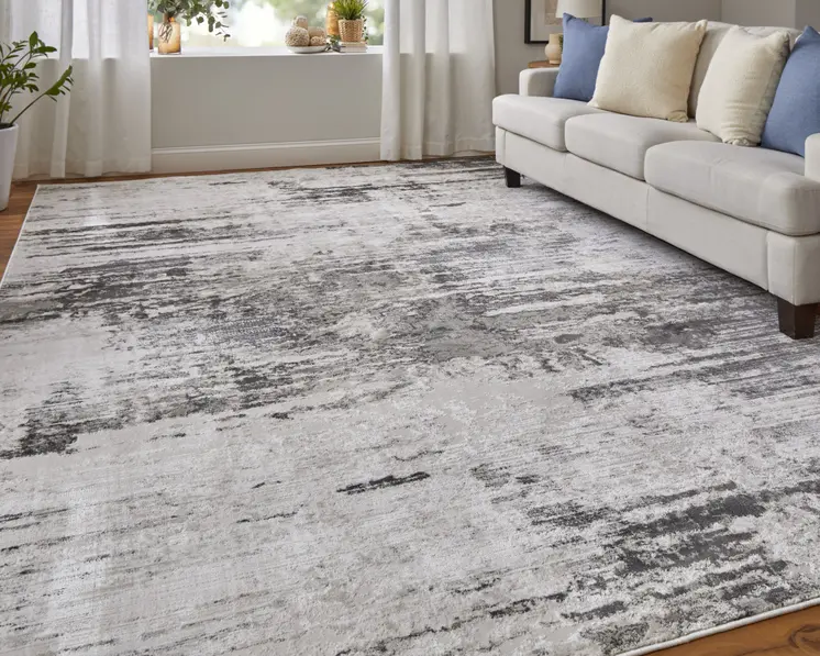 2' X 3' Ivory and Gray Abstract Power Loom Worn Faded Area Rug