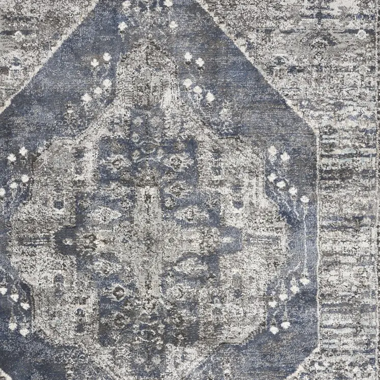 5' X 7' Blue Floral Power Loom Distressed Area Rug