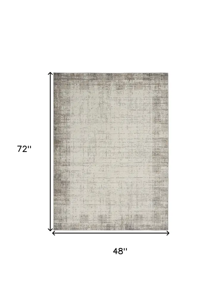 4' X 6' Ivory and Gray Abstract Area Rug