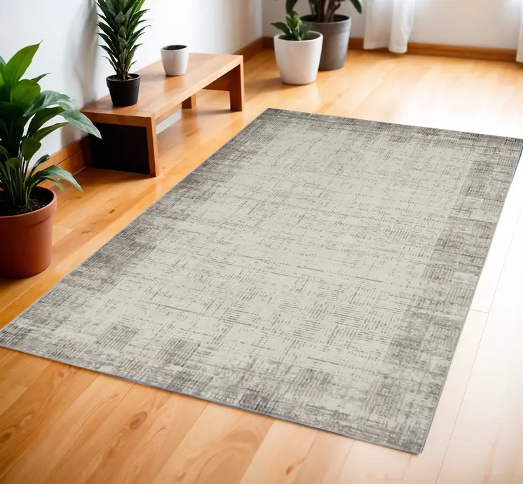 4' X 6' Ivory and Gray Abstract Area Rug
