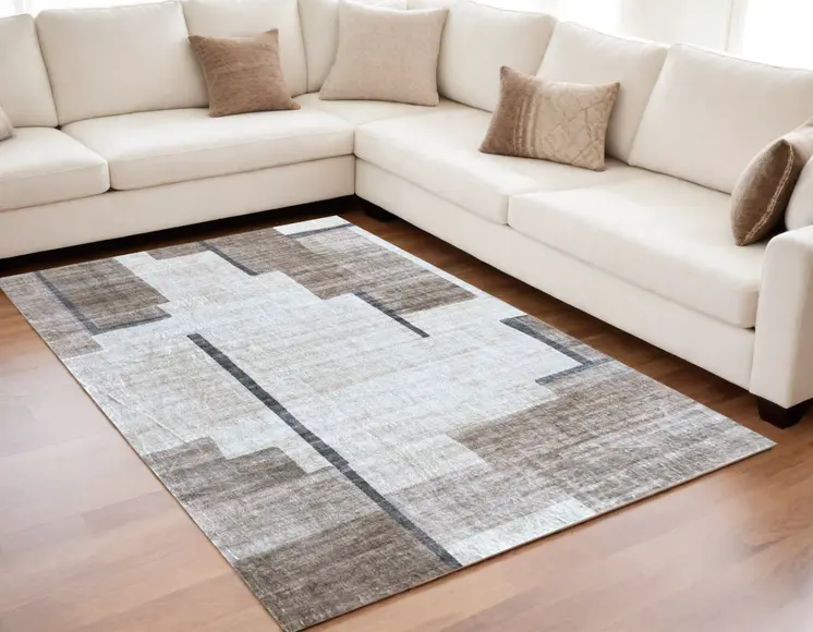 5' X 8' Beige and Brown Abstract Area Rug