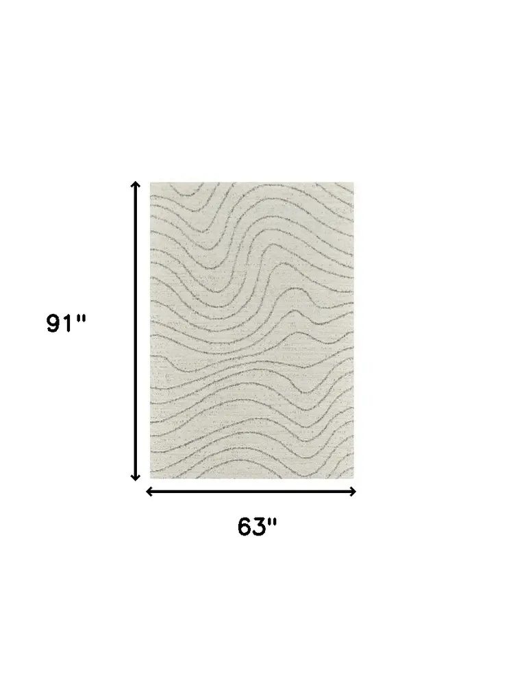 5' X 8' Cream and Beige Abstract Area Rug