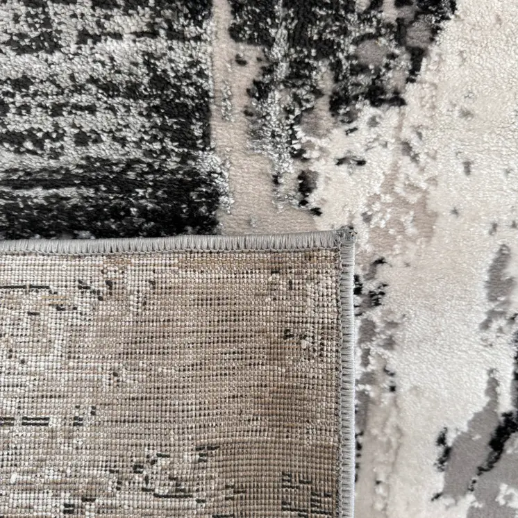 4' X 6' Black Gray and Beige Abstract Area Rug