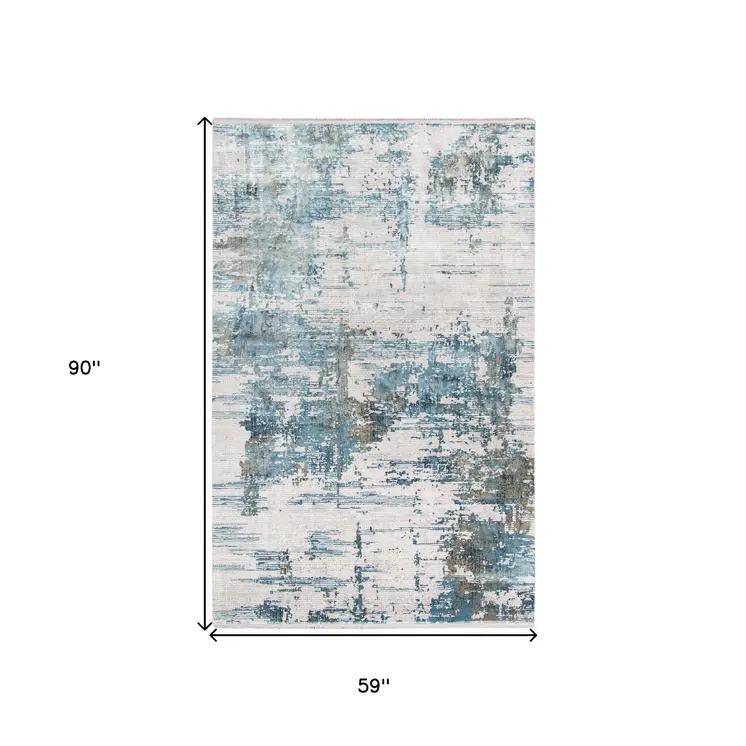 5' X 8' Ivory Blue And Brown Abstract Area Rug With Fringe