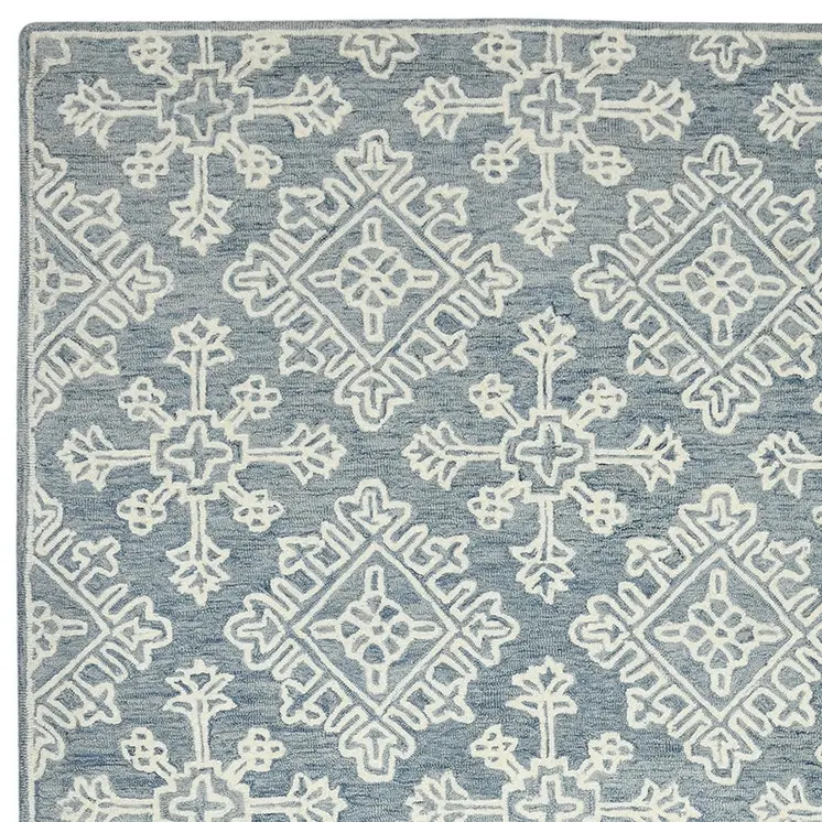 5' X 7' Sky Blue And Ivory Wool Oriental Hand Hooked Area Rug
