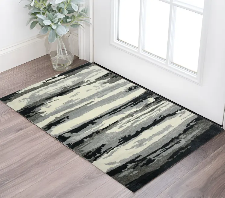2' X 3' Dark Gray Black And Ivory Wool Abstract Hand Tufted Area Rug