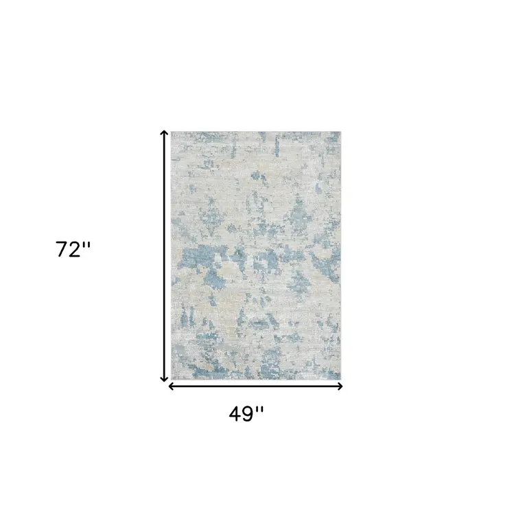 4' X 6' Ivory And Sky Blue Abstract Area Rug