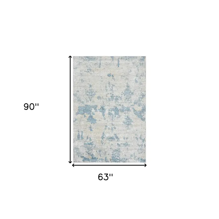 5' X 8' Ivory And Sky Blue Abstract Area Rug
