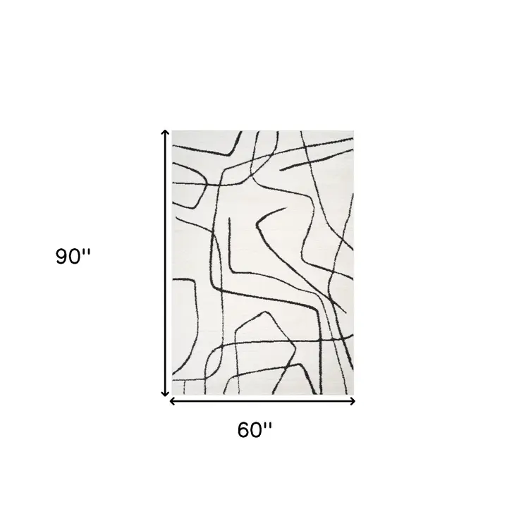 5' X 7' Ivory And Black Abstract Area Rug