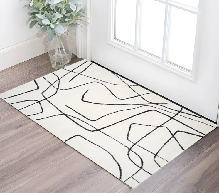 2' X 3' Ivory And Black Abstract Area Rug