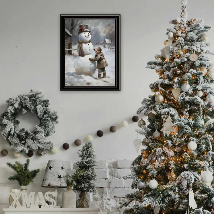 Boy Building A Snowman Black Framed Wall Art