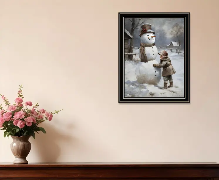 Boy Building A Snowman Black Framed Wall Art