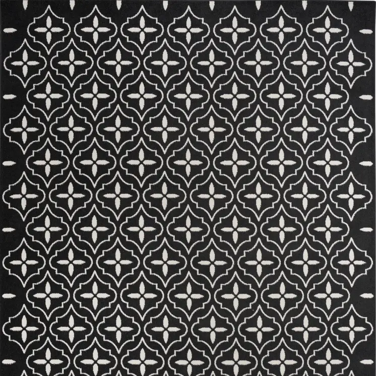 5' X 7' Black And Ivory Geometric Indoor Outdoor Area Rug