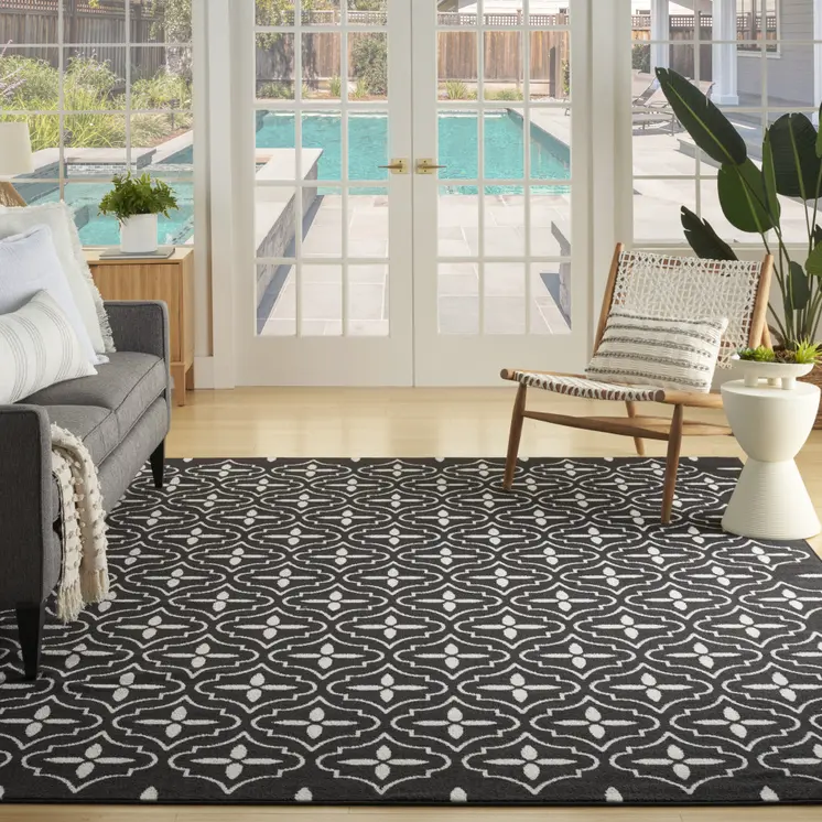 5' X 7' Black And Ivory Geometric Indoor Outdoor Area Rug
