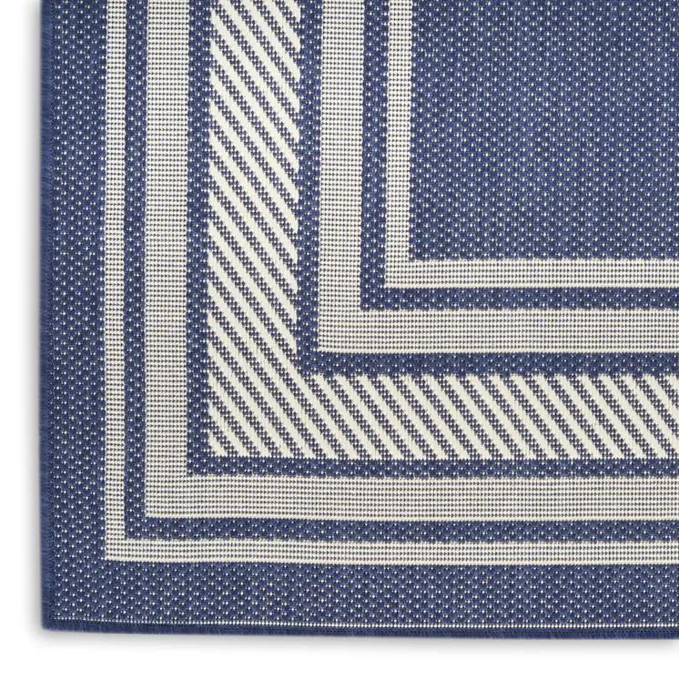 6' X 9' Navy Blue And Ivory Geometric Indoor Outdoor Area Rug