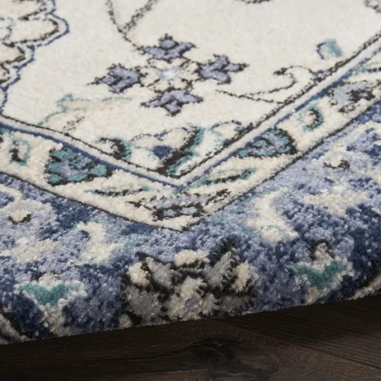 6' X 9' Ivory And Blue Floral Indoor Outdoor Area Rug