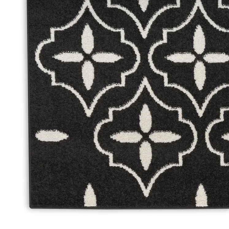 6' X 9' Black And Ivory Geometric Indoor Outdoor Area Rug