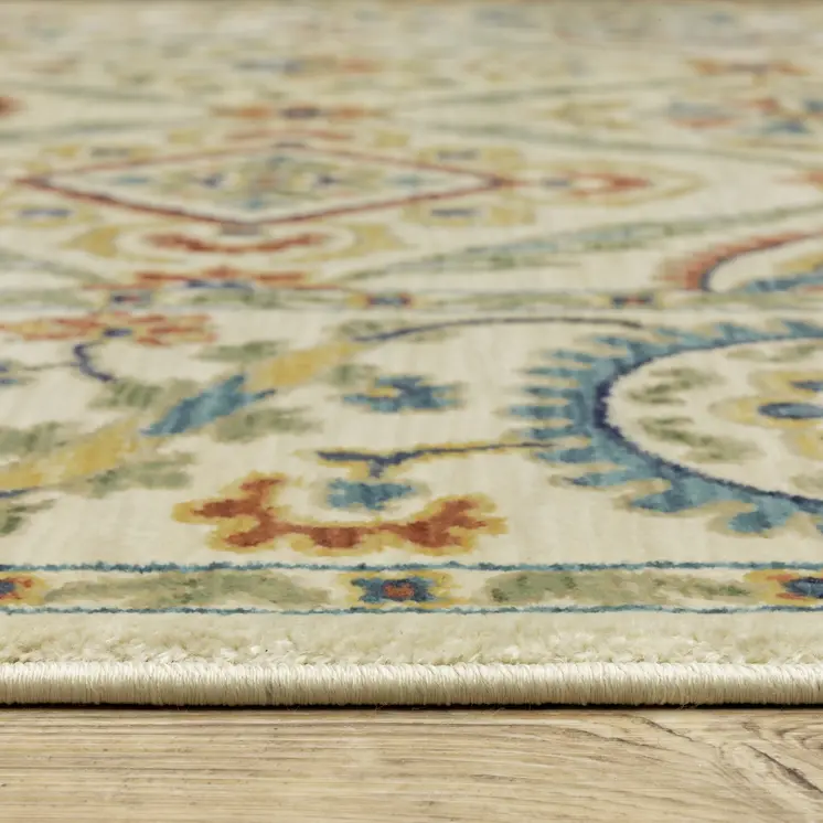 5' X 8' Ivory Blue And Orange Oriental Area Rug With Fringe