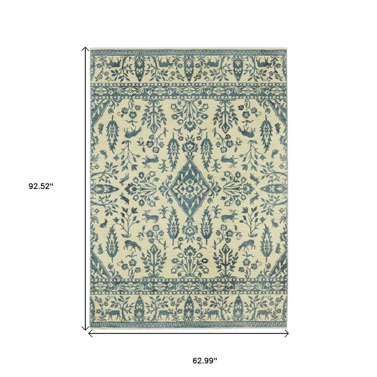 5' X 8' Ivory And Blue Oriental Area Rug With Fringe
