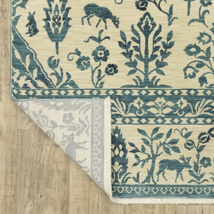 7' X 10' Ivory And Blue Oriental Area Rug With Fringe