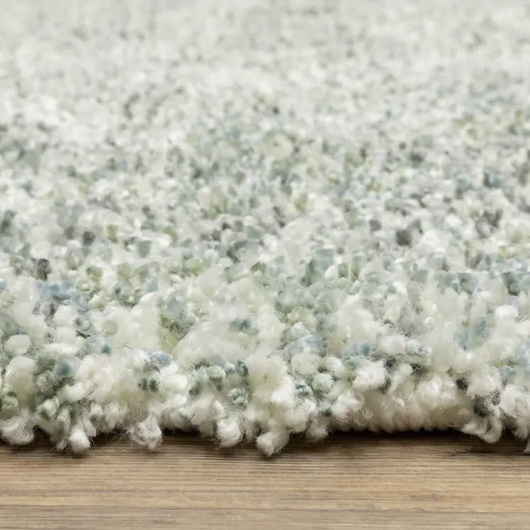 4' X 5' Light Blue And Ivory Abstract Shag Area Rug With Fringe