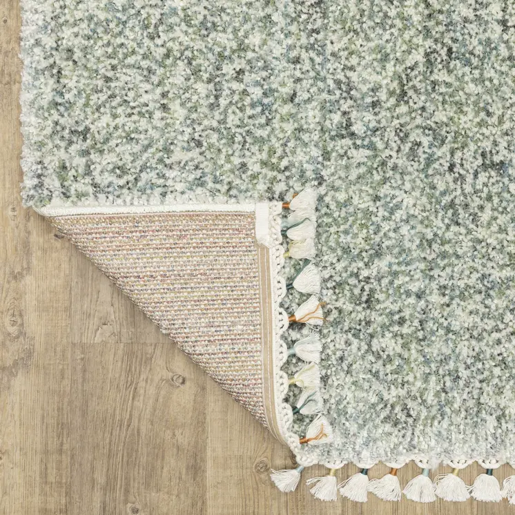 4' X 5' Light Blue And Ivory Abstract Shag Area Rug With Fringe