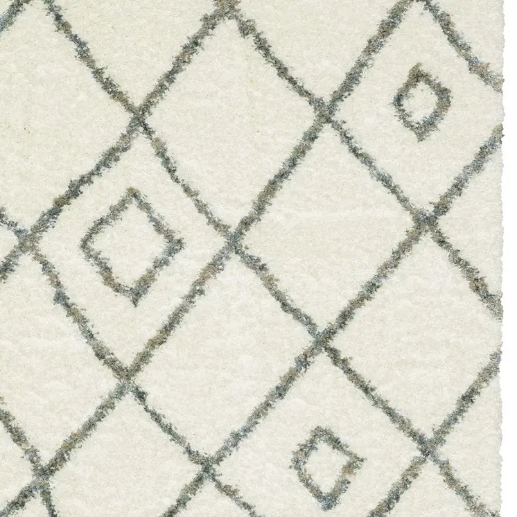 5' X 8' Ivory Gray And Tan Diamond Shag Area Rug With Fringe