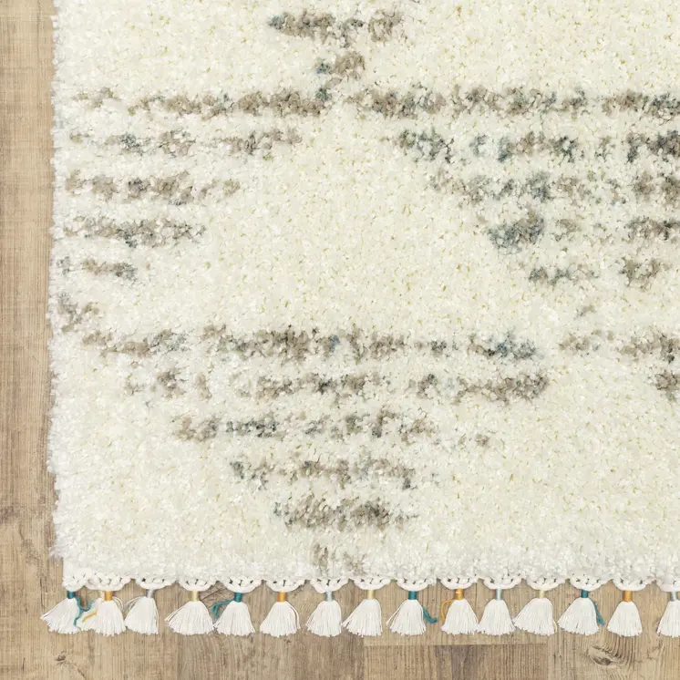 4' X 5' Ivory And Green Geometric Shag Area Rug With Fringe