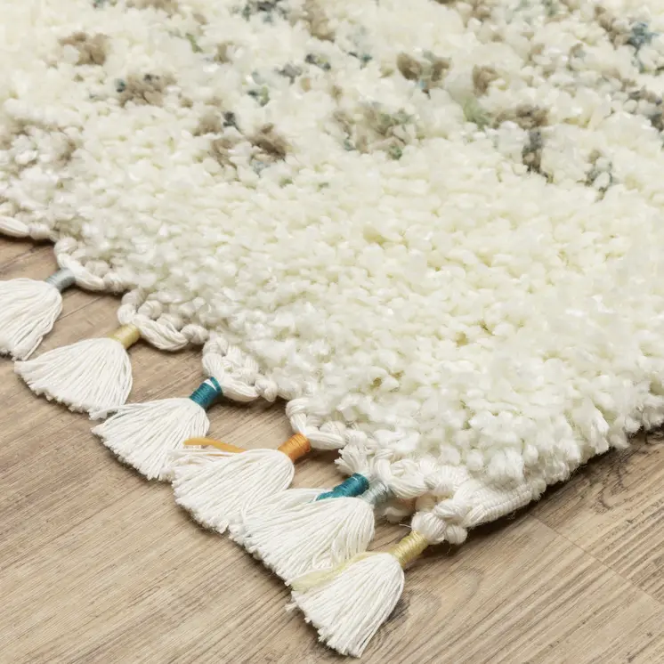 7' X 10' Ivory And Green Geometric Shag Area Rug With Fringe