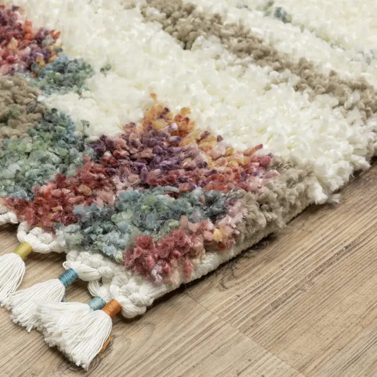 5' X 8' Tan Gray And Ivory Abstract Shag Distressed Area Rug With Fringe