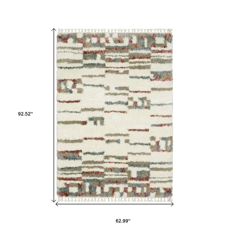 5' X 8' Tan Gray And Ivory Abstract Shag Distressed Area Rug With Fringe