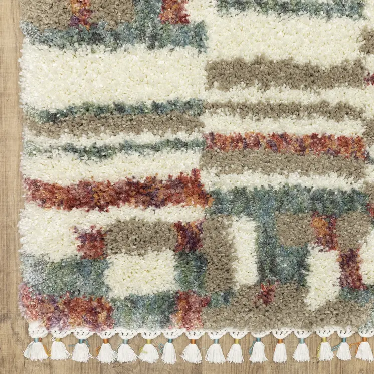 7' X 10' Tan Gray And Ivory Abstract Shag Distressed Area Rug With Fringe