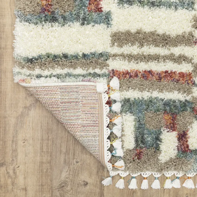8' X 11' Tan Gray And Ivory Abstract Shag Distressed Area Rug With Fringe